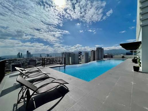 Rooftop pool and sun deck — space to pause above the city